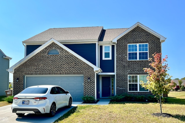 view of front facade featuring a garage and a front yard