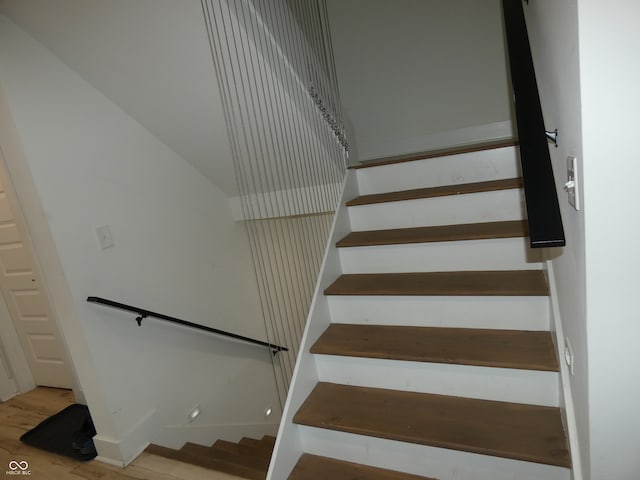 staircase featuring hardwood / wood-style floors