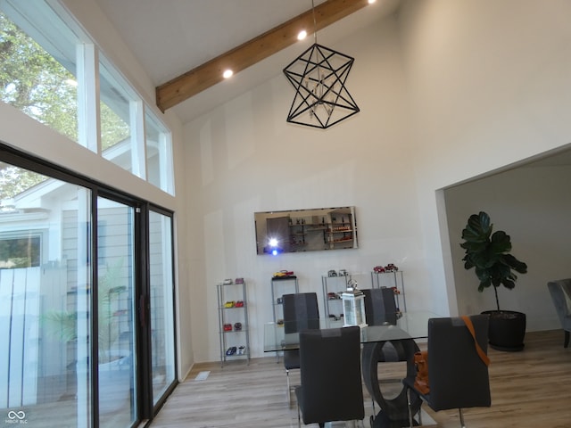 office area featuring high vaulted ceiling, beam ceiling, and light hardwood / wood-style flooring