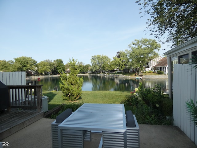 view of patio with a deck with water view