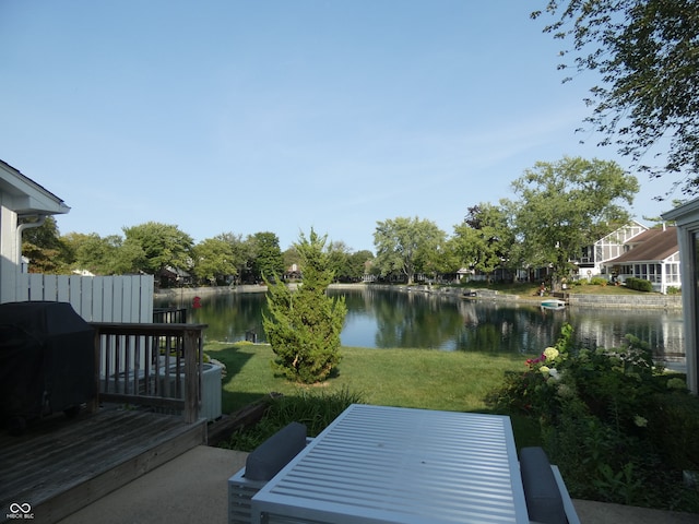 exterior space with a deck with water view