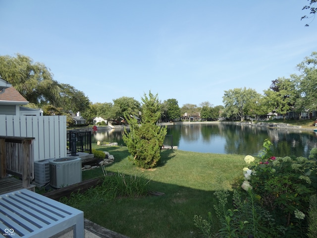 view of yard with a water view and cooling unit