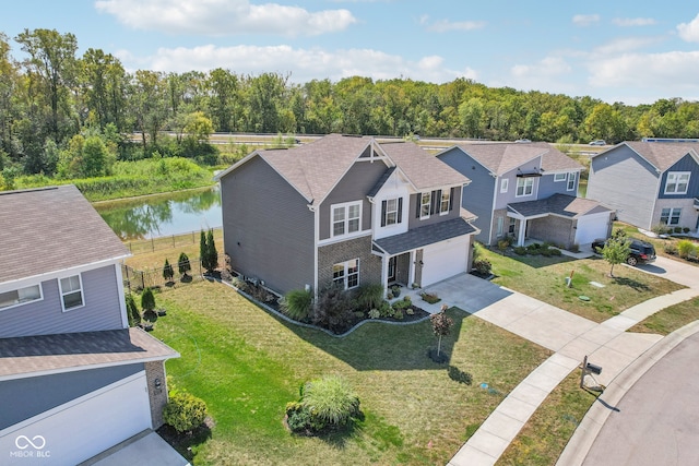 birds eye view of property with a water view