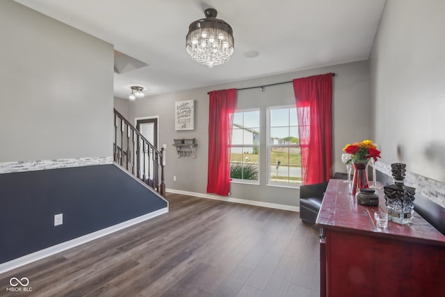 office space with a notable chandelier and dark hardwood / wood-style flooring