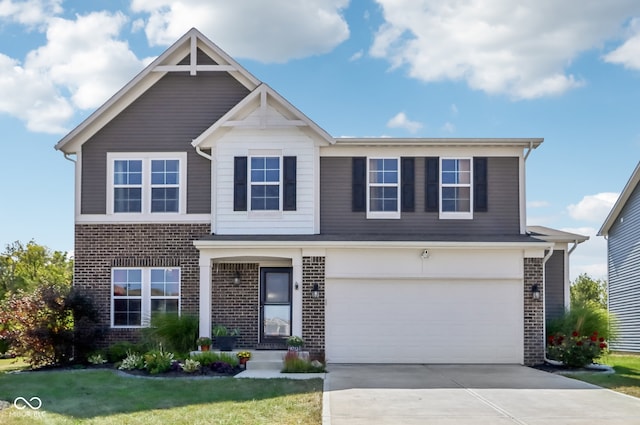 view of front of home with a garage and a front yard