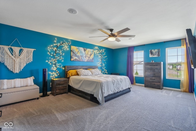 carpeted bedroom featuring ceiling fan