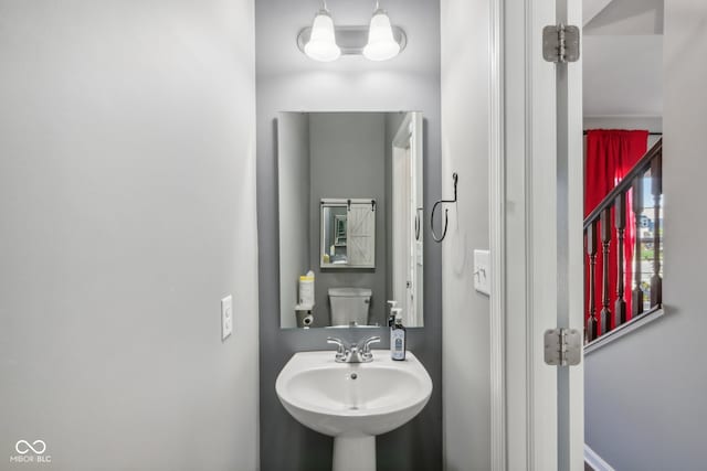 bathroom with toilet and sink