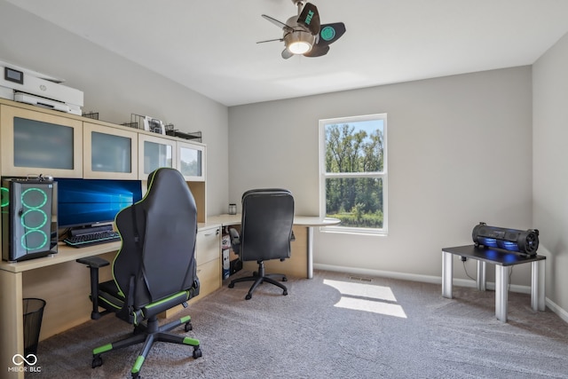 carpeted home office with ceiling fan