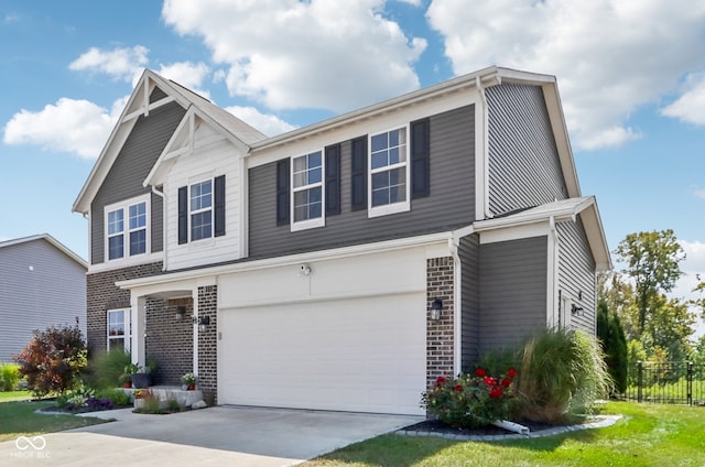 view of front of house featuring a garage and a front yard