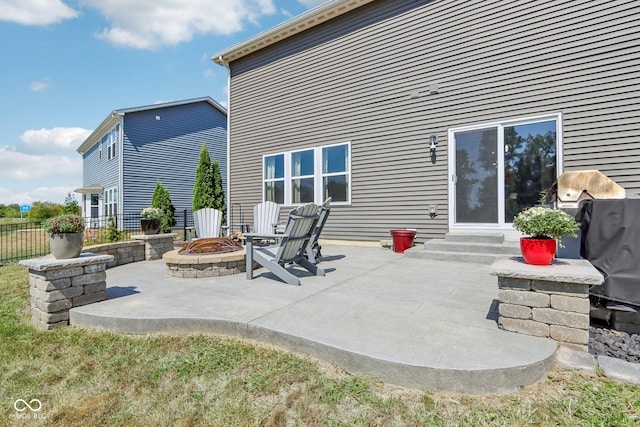 view of patio / terrace featuring an outdoor fire pit