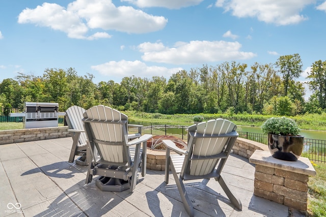 view of patio / terrace featuring an outdoor fire pit