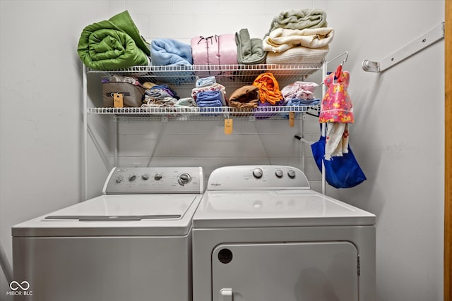 clothes washing area featuring washing machine and clothes dryer