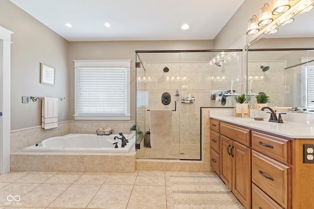 bathroom featuring vanity, a wealth of natural light, separate shower and tub, and tile patterned floors