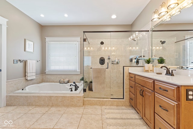bathroom with a stall shower, recessed lighting, tile patterned floors, a garden tub, and vanity