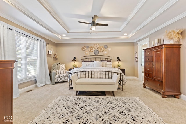 bedroom with baseboards, a raised ceiling, crown molding, and light colored carpet