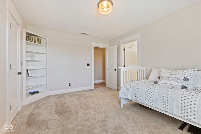 bedroom with light carpet