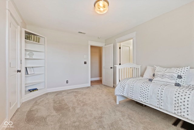 bedroom featuring baseboards, visible vents, and carpet flooring