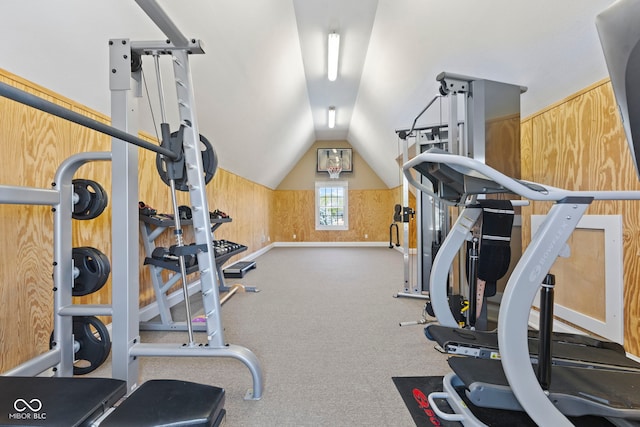 exercise room with baseboards, carpet, and lofted ceiling