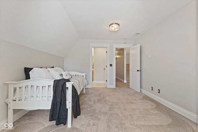 bedroom with lofted ceiling, visible vents, carpet, and baseboards