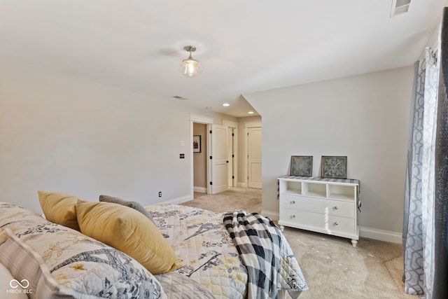 bedroom featuring light colored carpet, visible vents, recessed lighting, and baseboards
