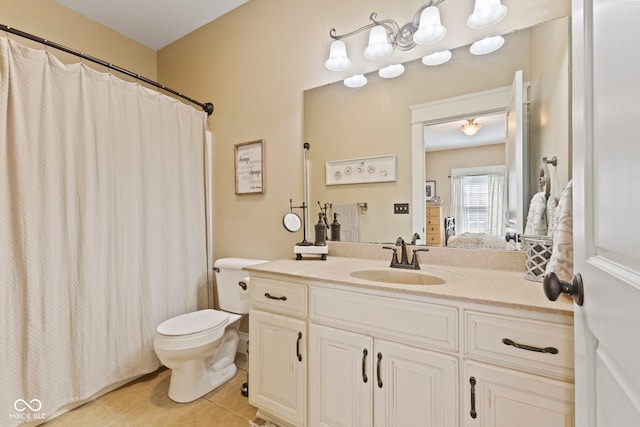 bathroom with tile patterned floors, walk in shower, vanity, and toilet