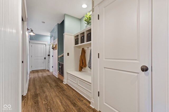 mudroom with dark wood-style floors