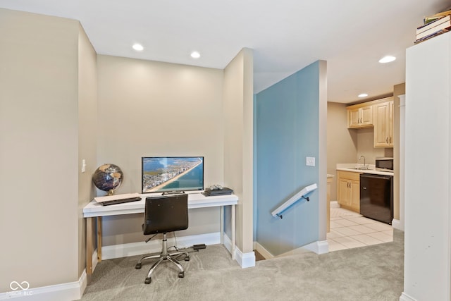 office space featuring baseboards, recessed lighting, light carpet, and a sink