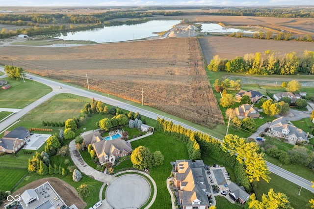 birds eye view of property featuring a rural view and a water view