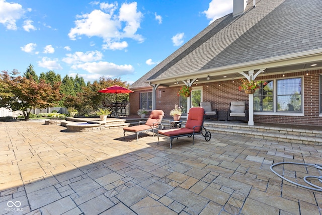 view of patio featuring a fire pit