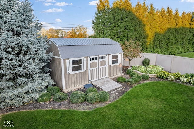 view of outbuilding featuring a yard