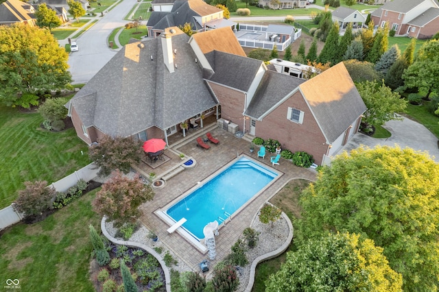 birds eye view of property with a residential view