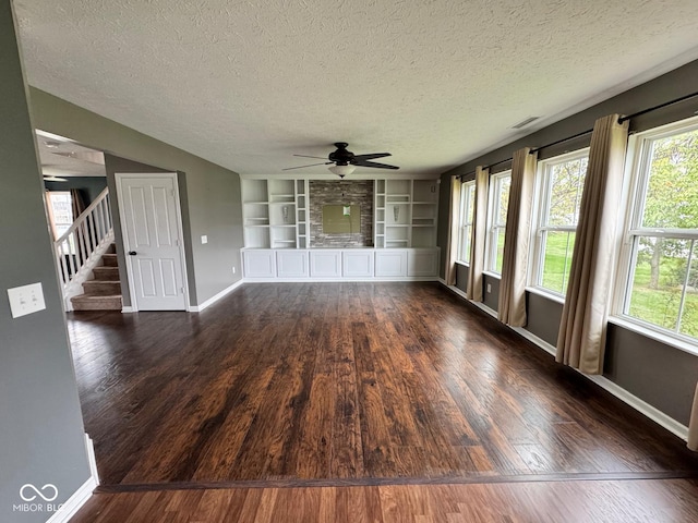 unfurnished sunroom with ceiling fan