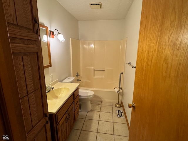 full bathroom featuring toilet, tile patterned flooring, vanity, a textured ceiling, and washtub / shower combination