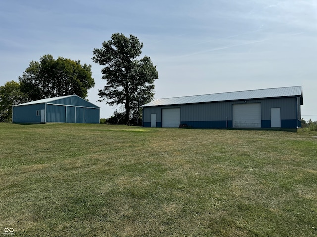 exterior space with an outbuilding and a garage