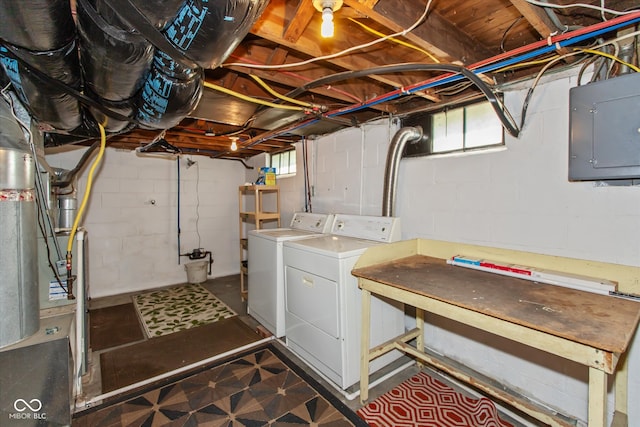 clothes washing area featuring washing machine and clothes dryer and electric panel