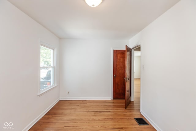 empty room with light wood-type flooring