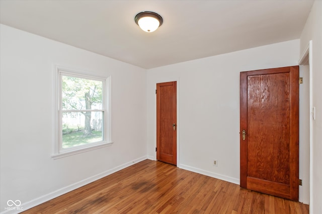 spare room featuring light wood-type flooring