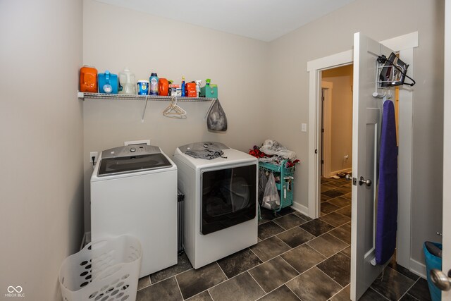 1569 Tupelo Dr, Greenfield, IN 46140 - laundry area with washer and clothes dryer and baseboards