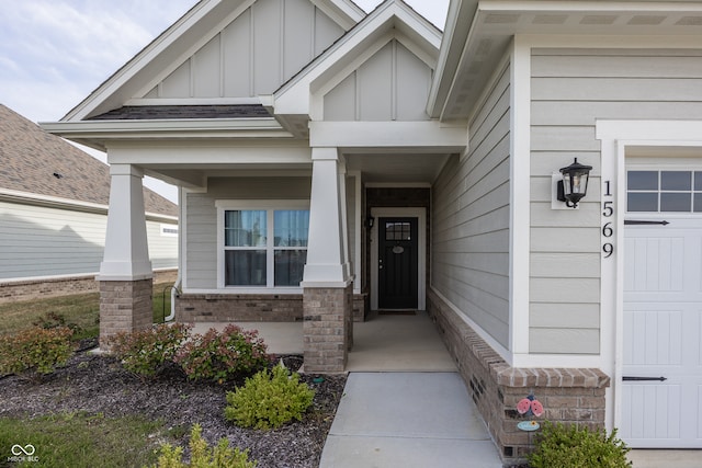 1569 Tupelo Dr, Greenfield, IN 46140 - property entrance with board and batten siding, covered porch, and brick siding