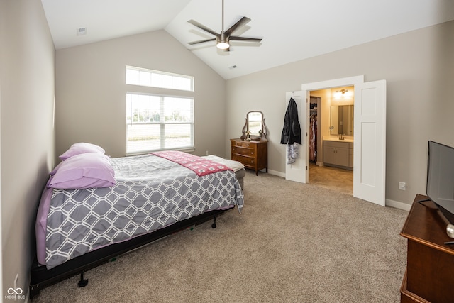 1569 Tupelo Dr, Greenfield, IN 46140 - bedroom with lofted ceiling, light carpet, baseboards, a ceiling fan, and ensuite bathroom