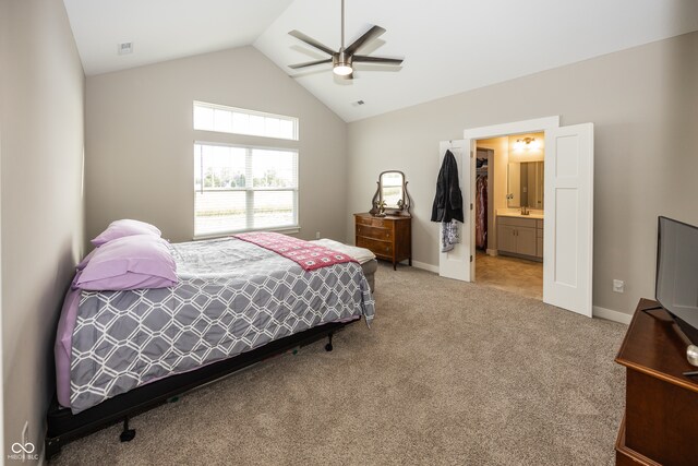 1569 Tupelo Dr, Greenfield, IN 46140 - bedroom with lofted ceiling, light carpet, baseboards, a ceiling fan, and ensuite bathroom
