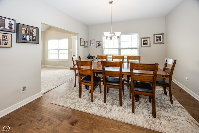 1569 Tupelo Dr, Greenfield, IN 46140 - dining room with a chandelier, baseboards, and dark wood-style floors