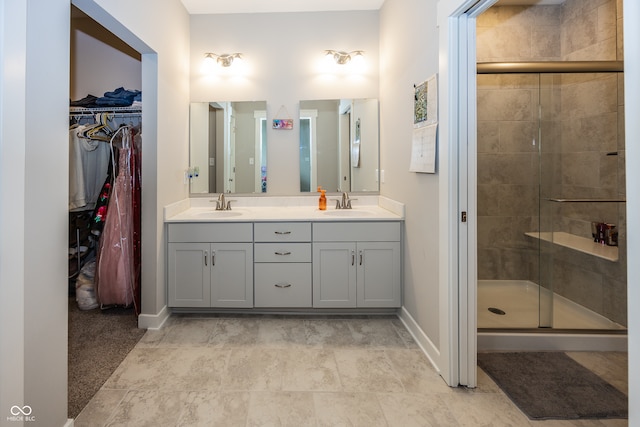 1569 Tupelo Dr, Greenfield, IN 46140 - bathroom featuring double vanity, a stall shower, and baseboards
