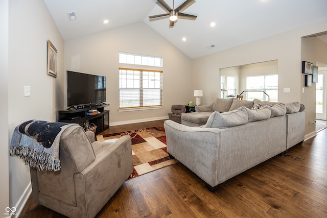 living room featuring lofted ceiling, ceiling fan, and dark hardwood / wood-style floors