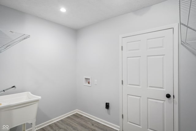 laundry room featuring hookup for a washing machine and wood-type flooring