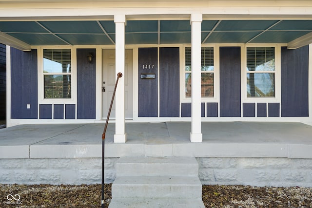 doorway to property featuring covered porch