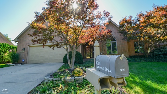 view of front of house with a front lawn and a garage