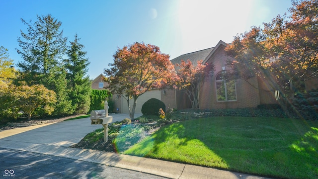 obstructed view of property with a front yard