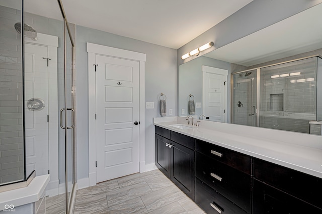 bathroom with vanity and an enclosed shower