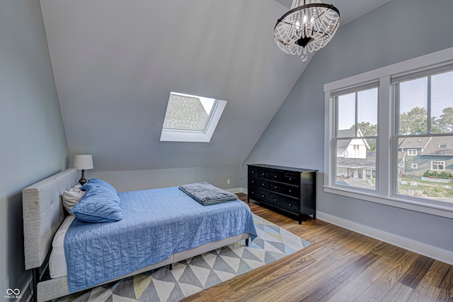 bedroom featuring hardwood / wood-style floors and a chandelier